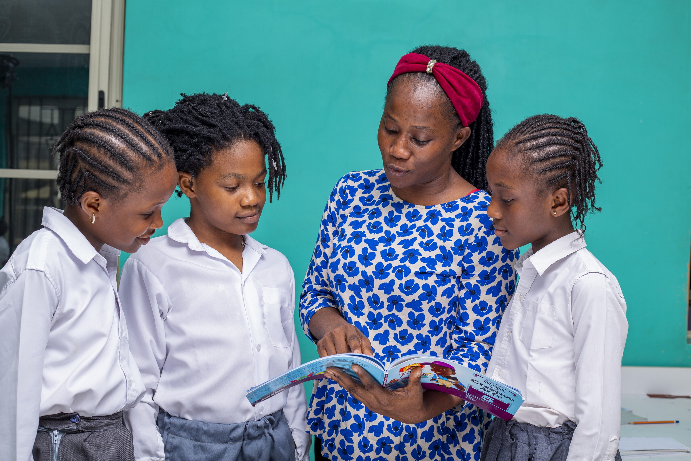 A Concord teacher offering close guidance to pupils