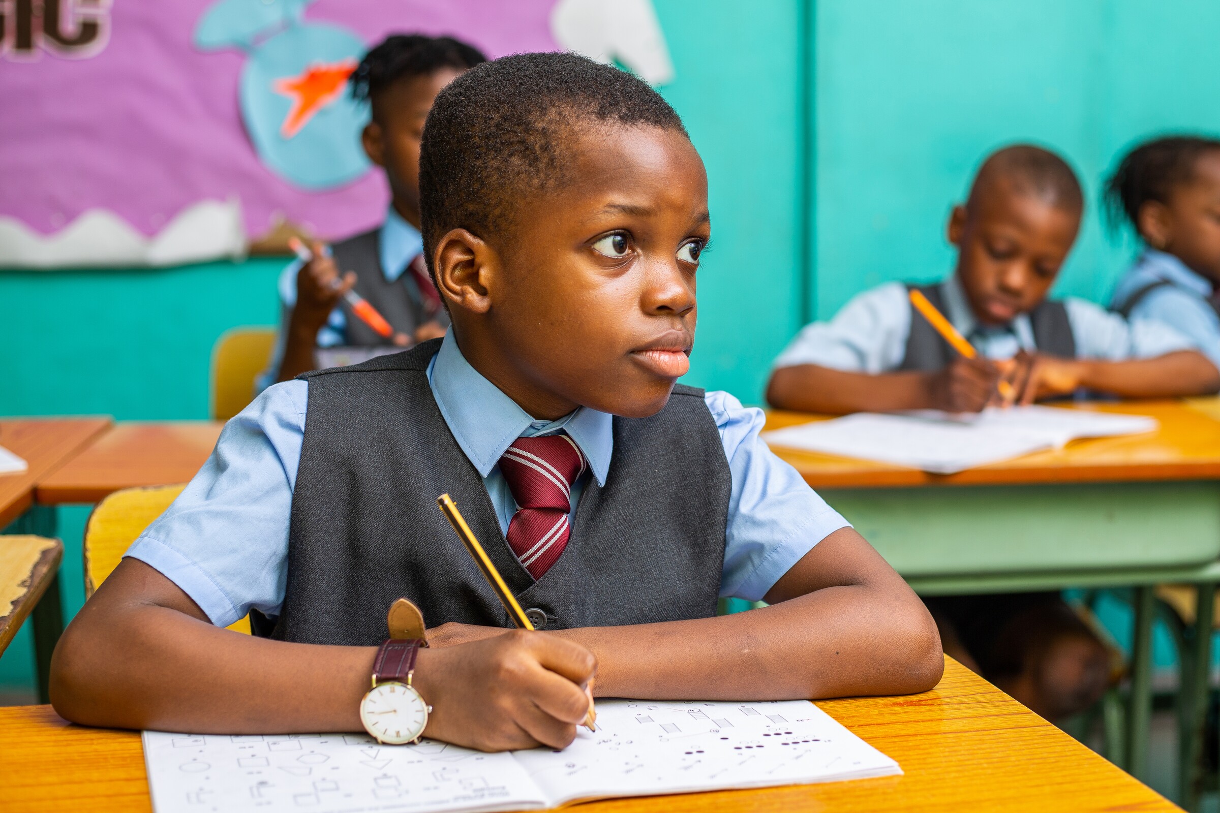 A Lower Prep pupil completing written work