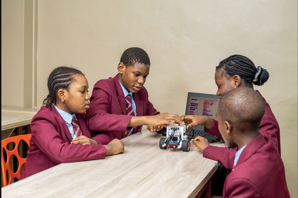 Concord students programming and testing a robot together