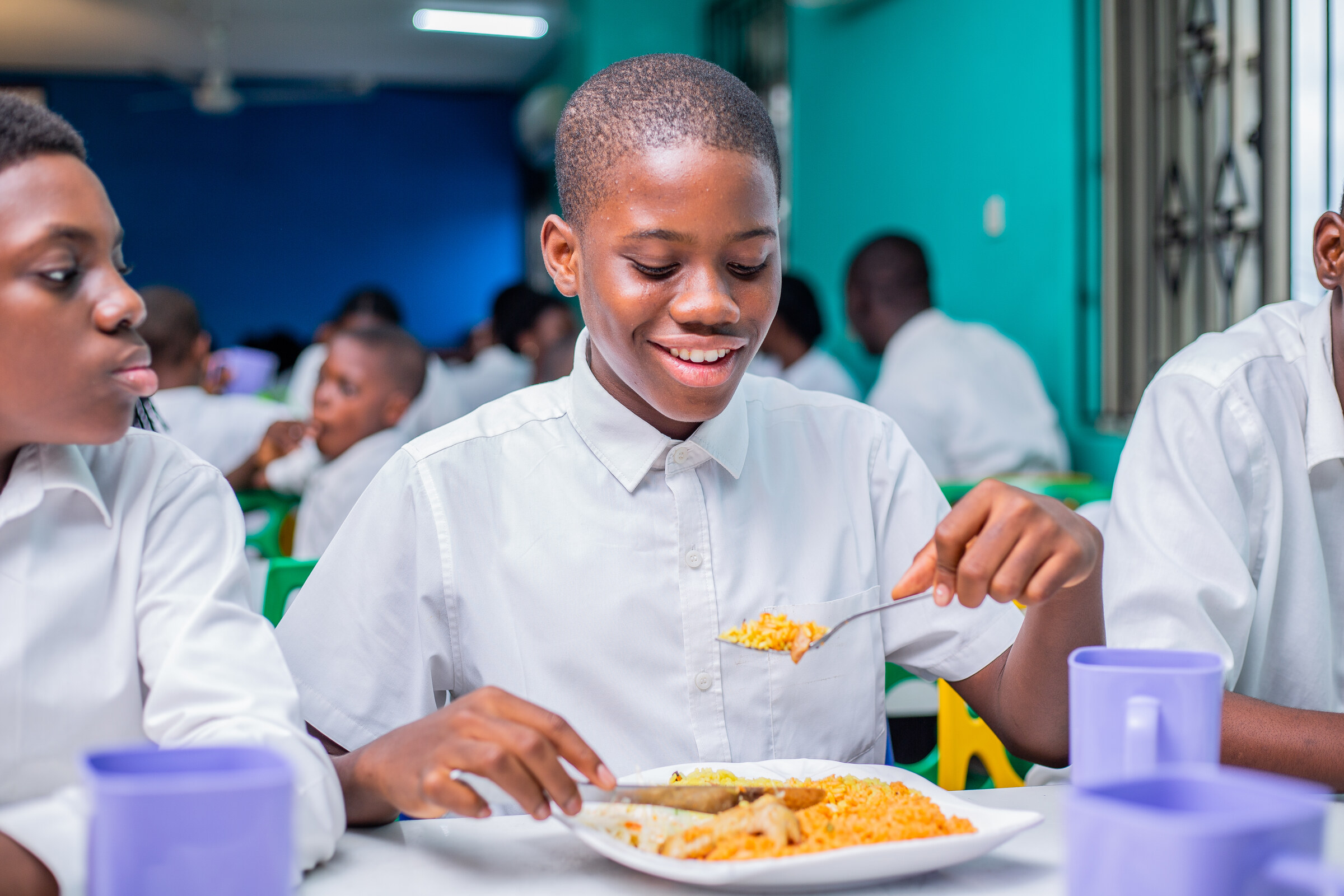 Concord boarding pupils enjoying a meal together