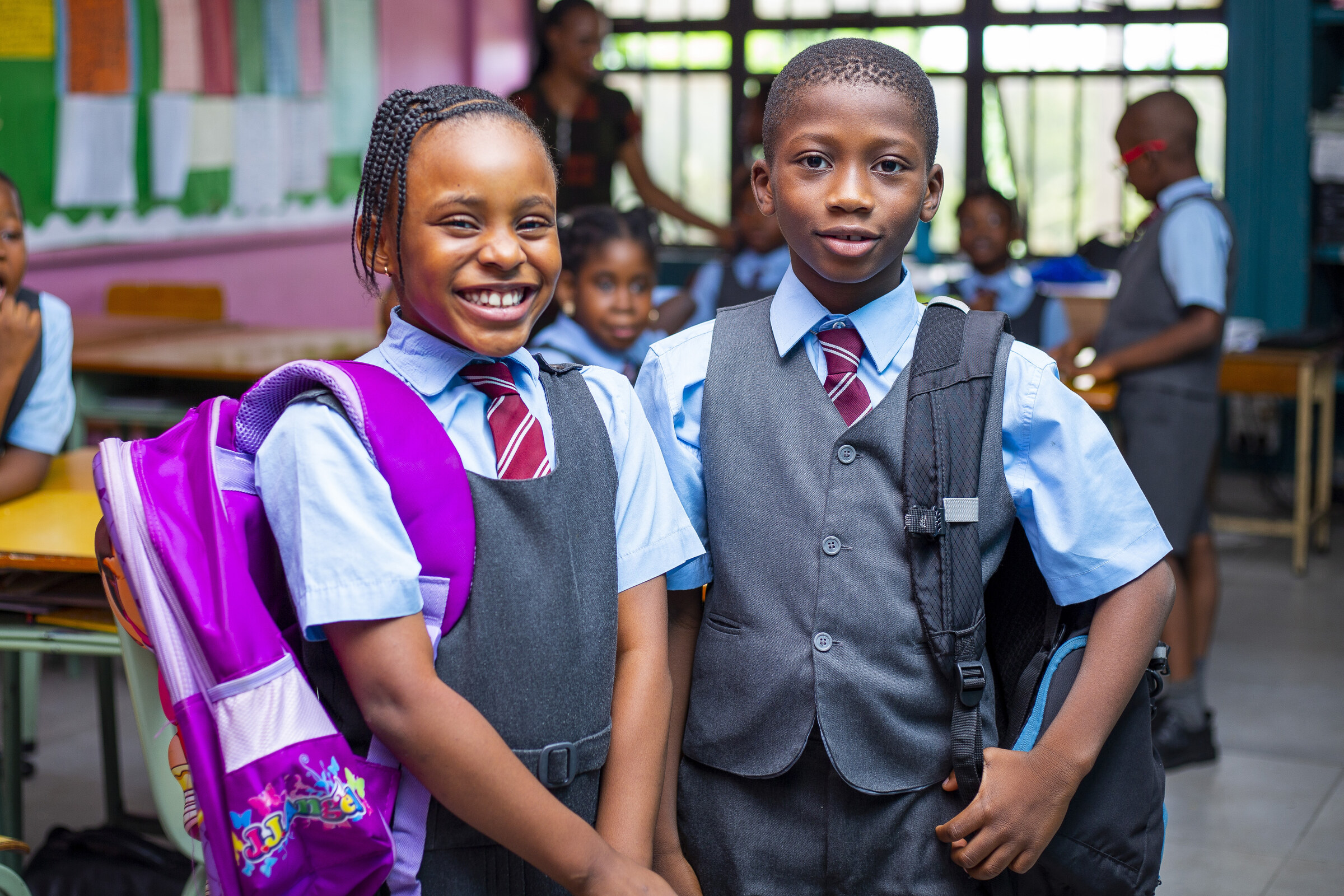 Two Concord Preparatory pupils smiling together