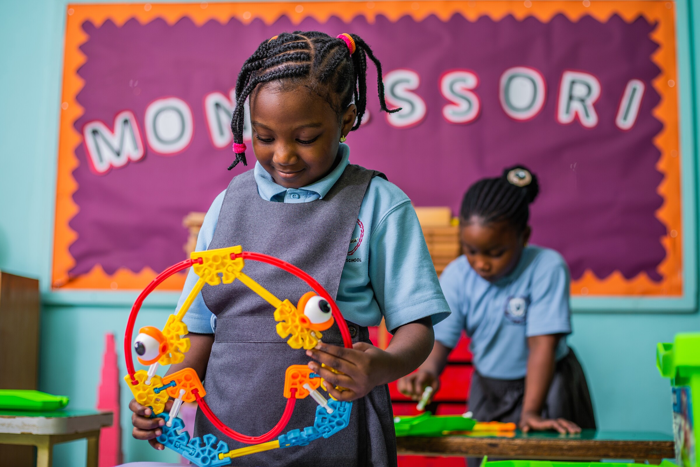 A young Concord pupil building carefully in class