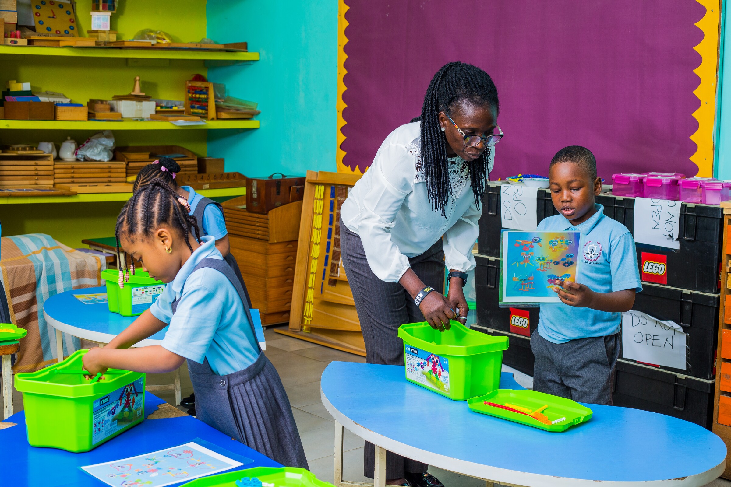 A Concord teacher guiding Early Years pupils through a classroom activity