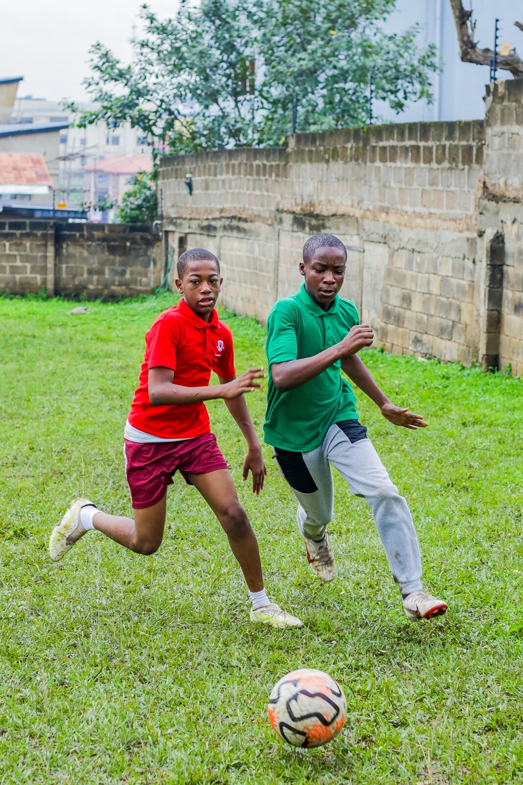 Two pupils competing for the ball